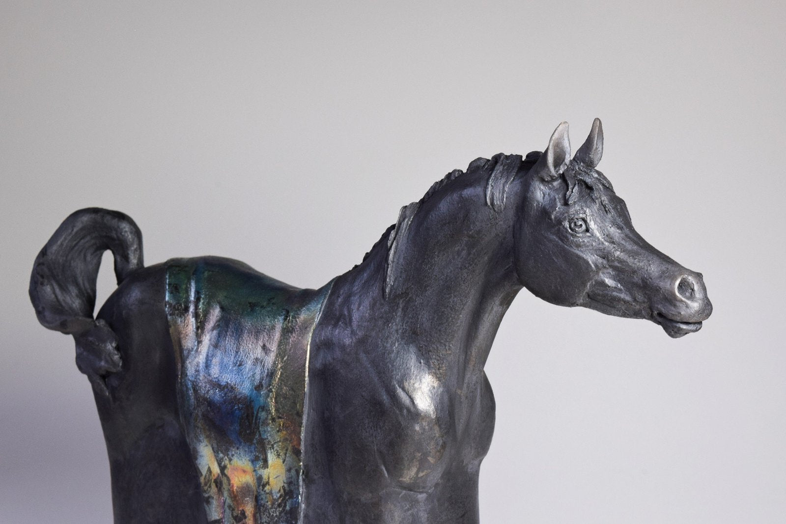 Black raku ceramic Arabian horse sculpture by Susie Benes