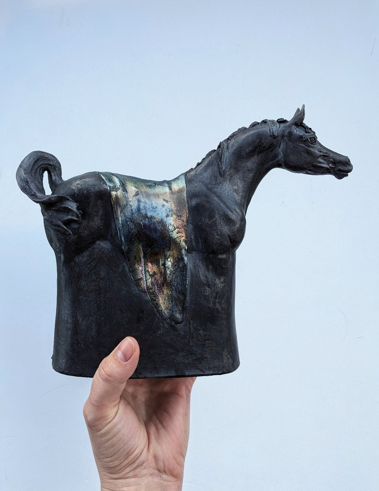 Black raku ceramic Arabian horse sculpture by Susie Benes