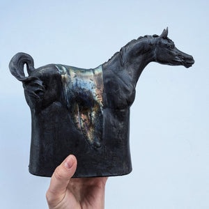 Black raku ceramic Arabian horse sculpture by Susie Benes