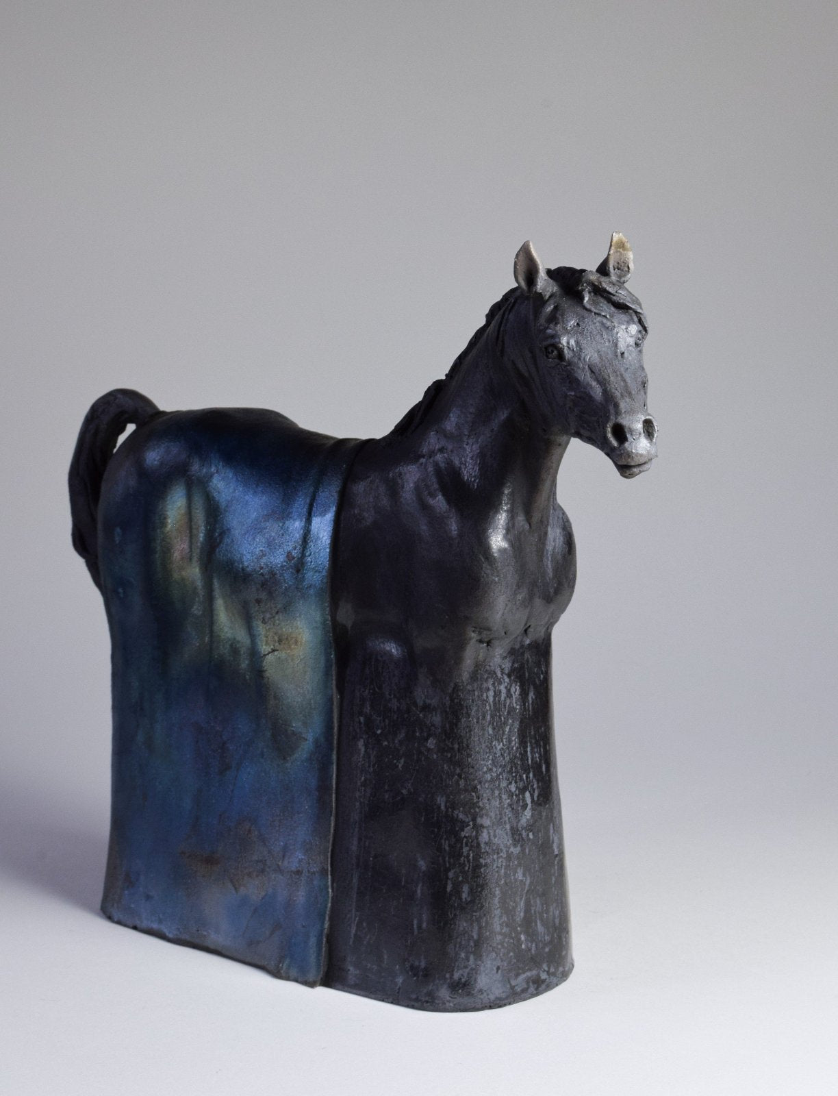 Black raku ceramic Arabian horse sculpture by Susie Benes