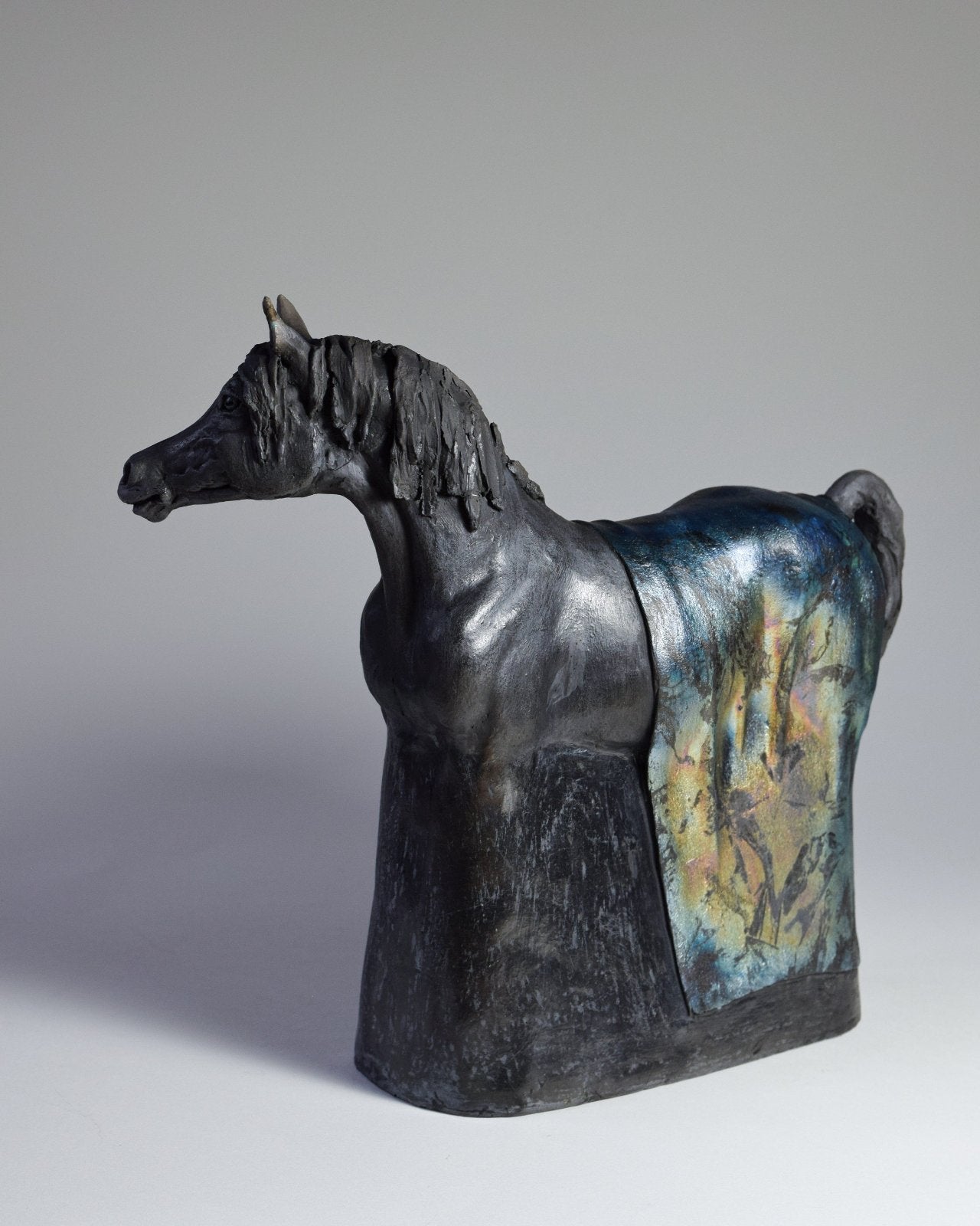 Black raku ceramic Arabian horse sculpture by Susie Benes