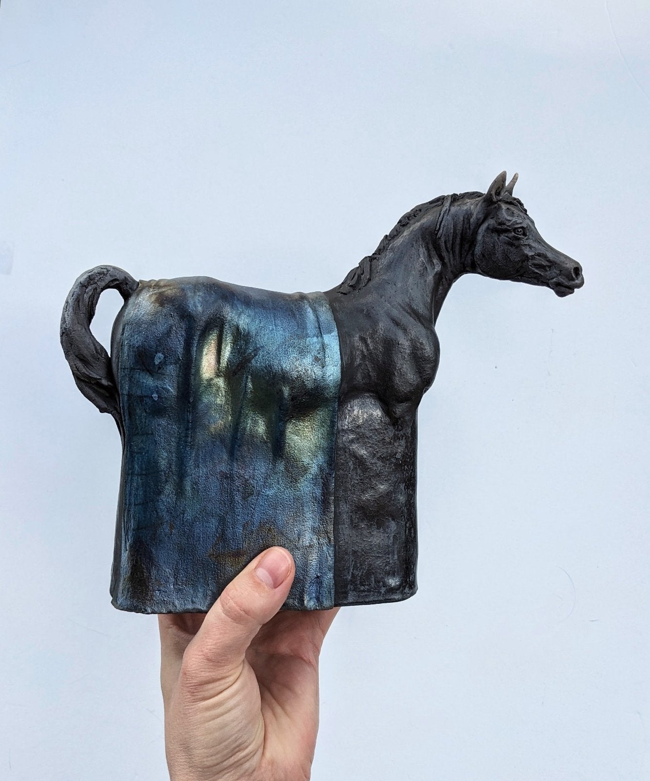 Black raku ceramic Arabian horse sculpture by Susie Benes