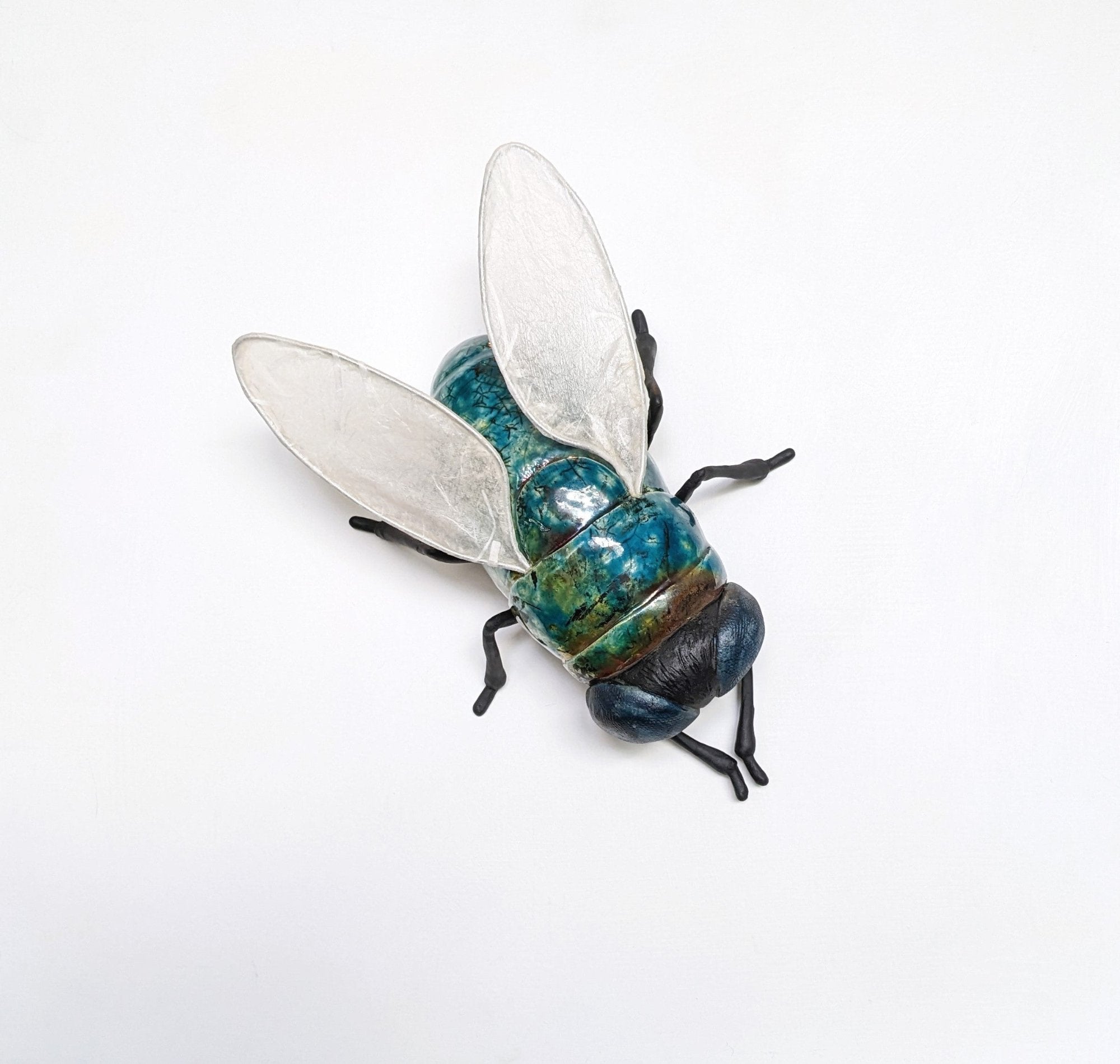 Giant fly wall sculpture from ceramic by Susie Benes