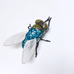 Giant fly wall sculpture from ceramic by Susie Benes