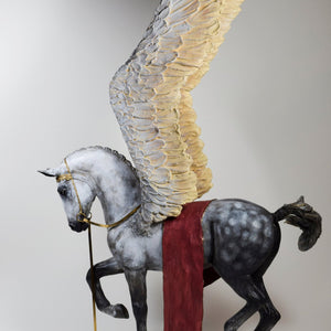 Pegasus with wings raised and gold bridle sculpture