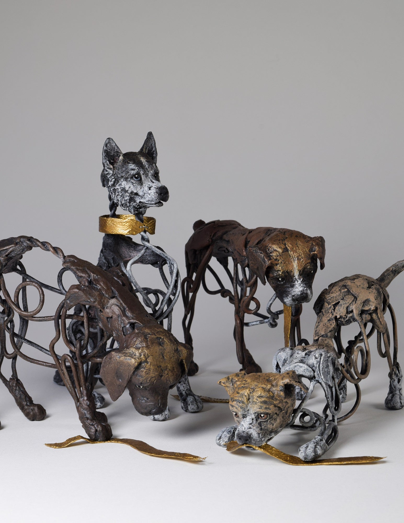 Air dry clay and wire dog sculpture collection by Susie Benes