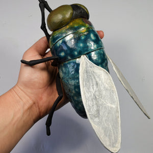 Giant ceramic fly wall sculpture by Susie Benes