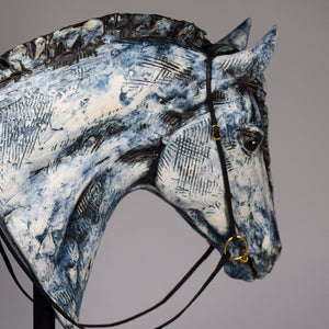 Blue ceramic horse head with braid sculpture by Susie Benes