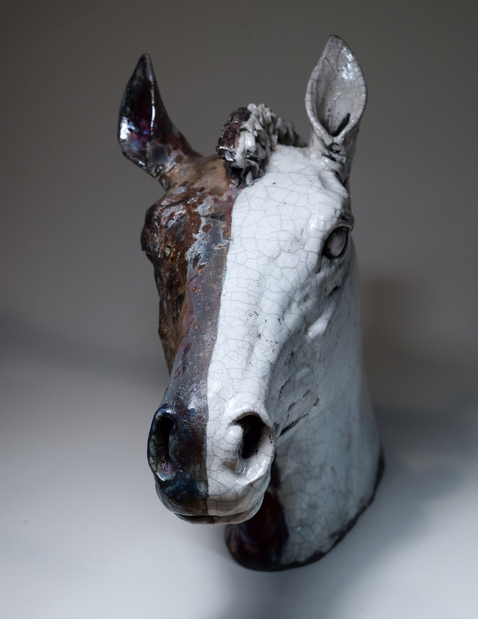 Raku ceramic horse head in black and white