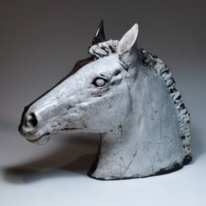 Raku ceramic horse head in black and white by Susie Benes