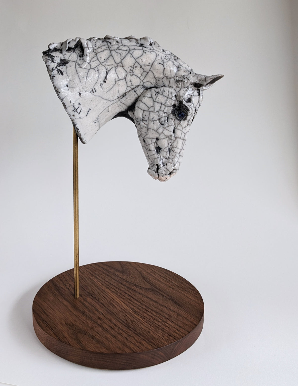 White crackle ceramic horse head sculpture by Susie Benes