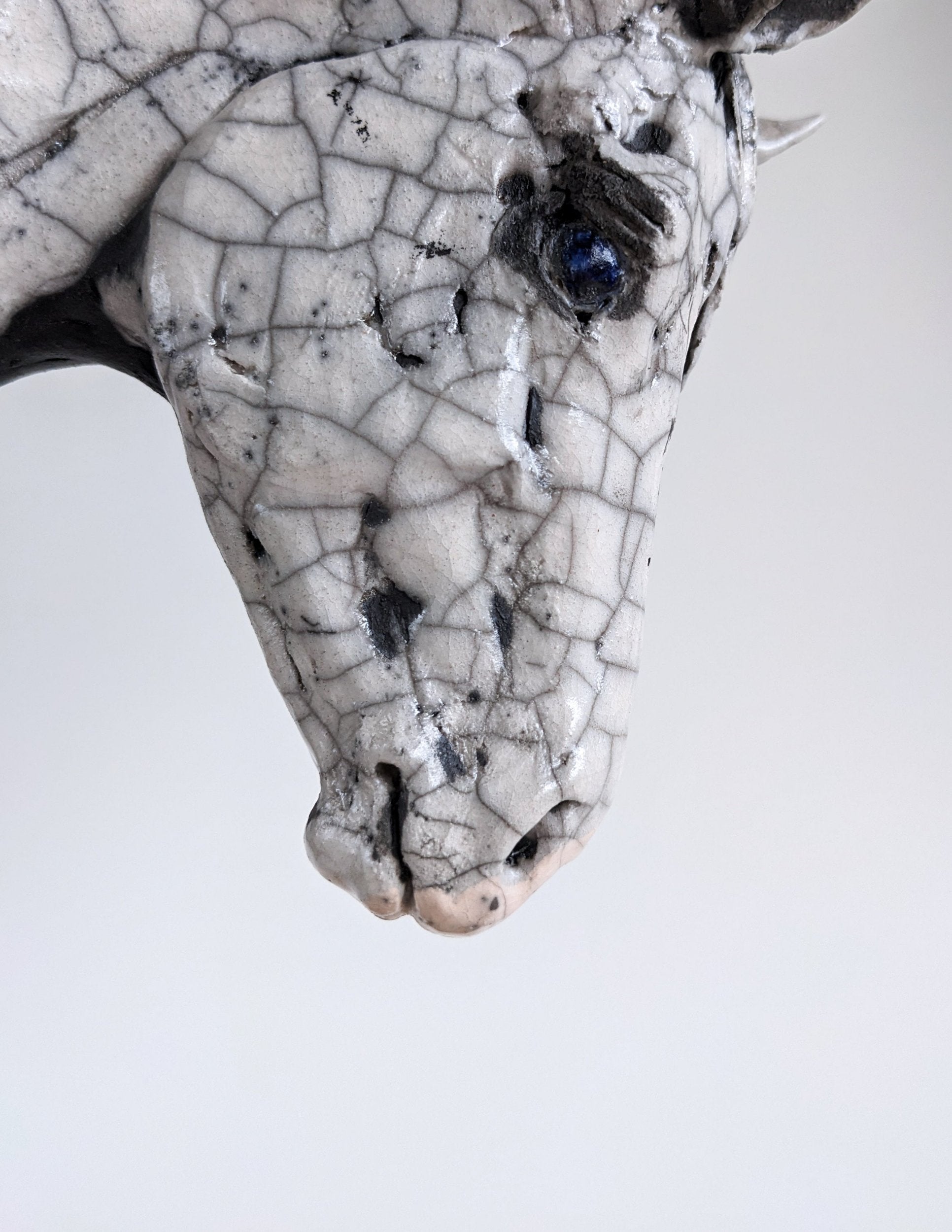 White crackle ceramic horse head sculpture by Susie Benes