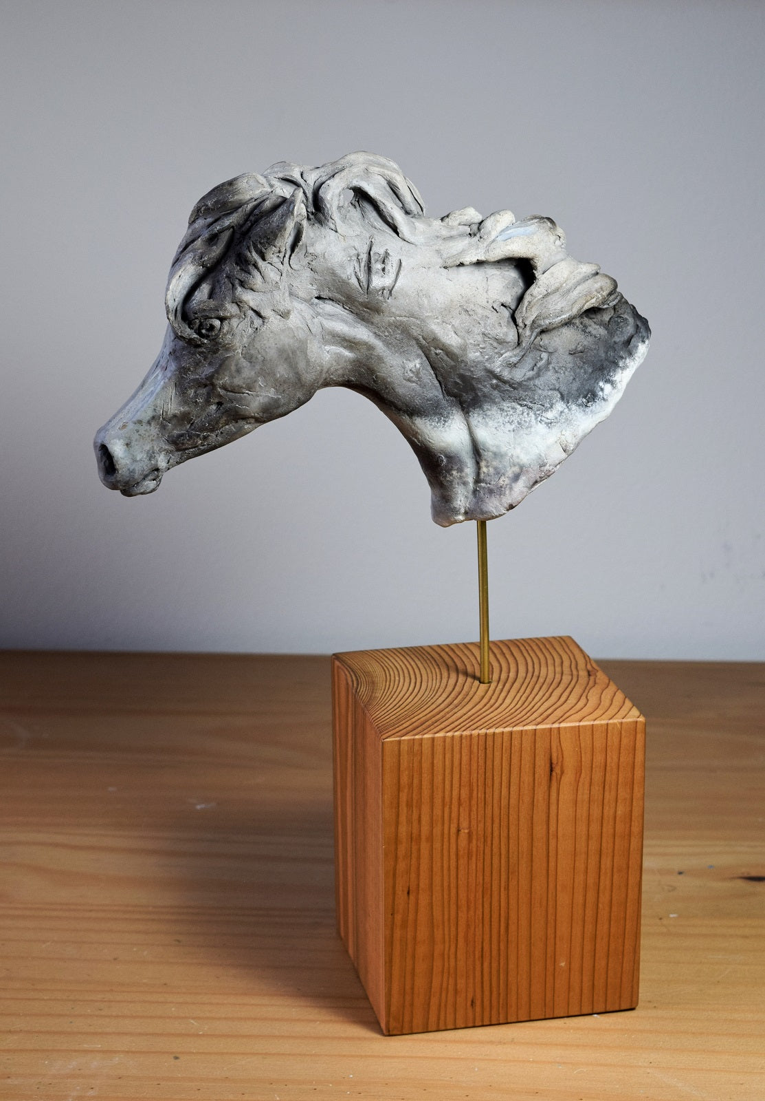 Smoke fired ceramic horse head sculpture by Susie Benes