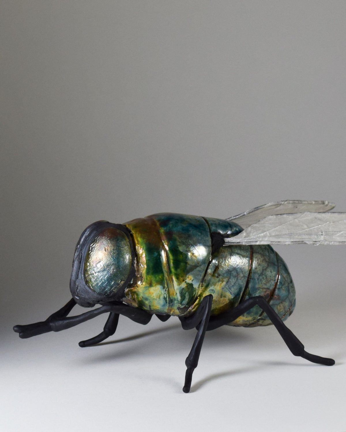 giant ceramic fly art sculpture by Susie Benes