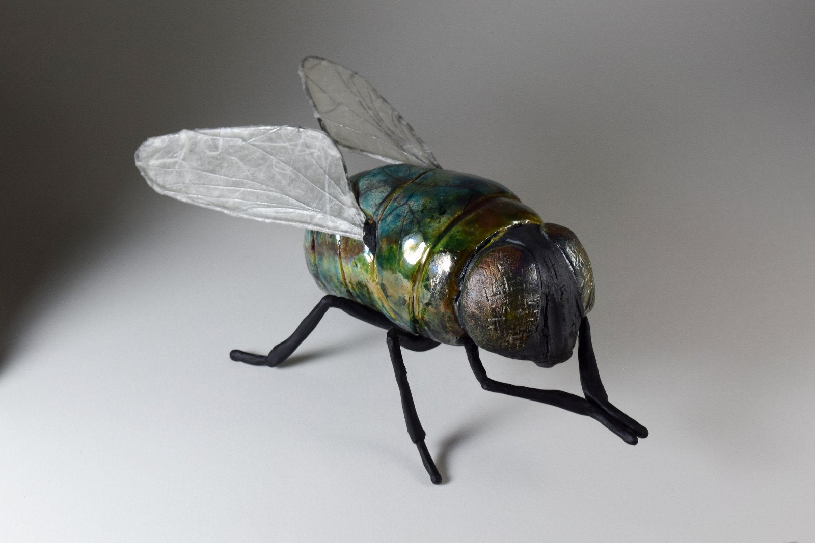 giant ceramic fly art sculpture by Susie Benes