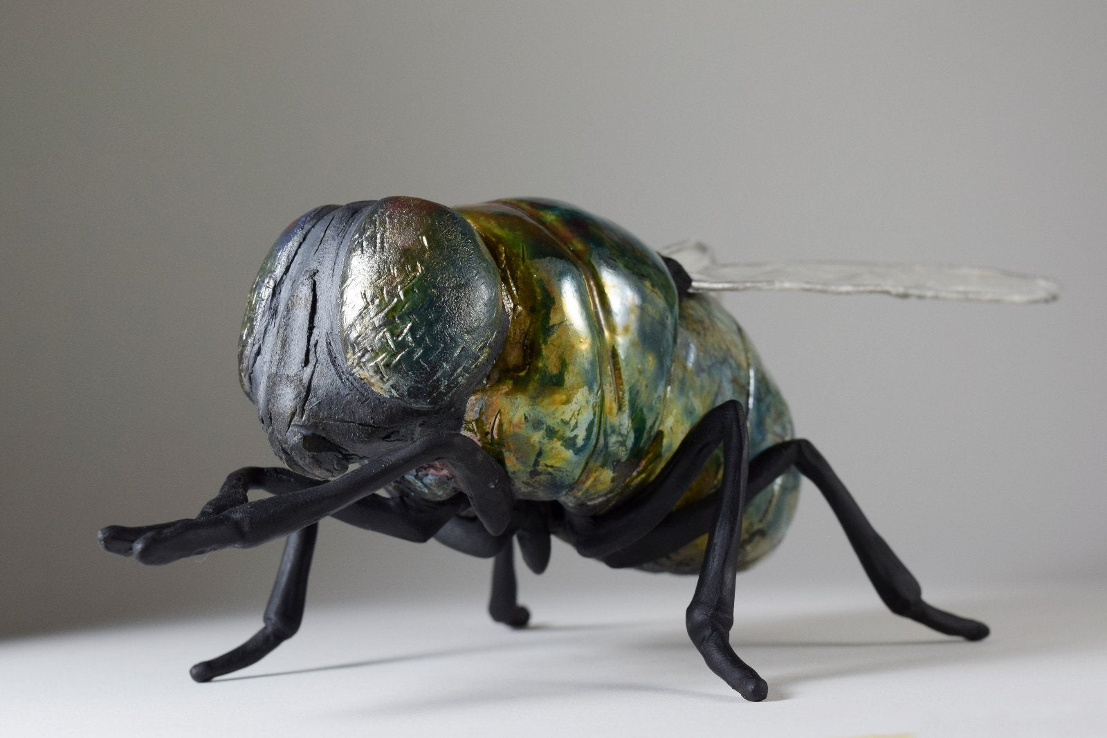 giant ceramic fly art sculpture by Susie Benes