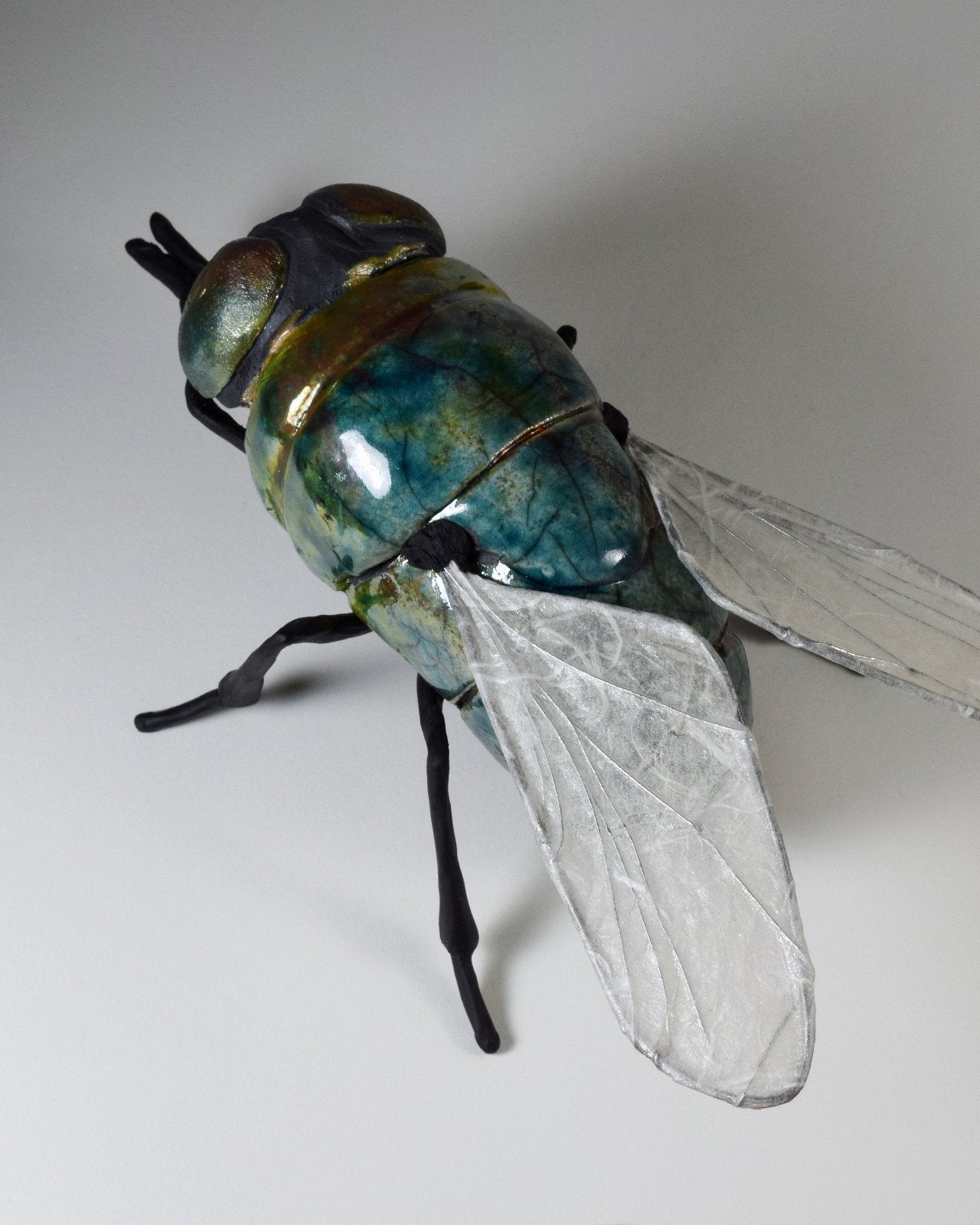 giant ceramic fly art sculpture by Susie Benes