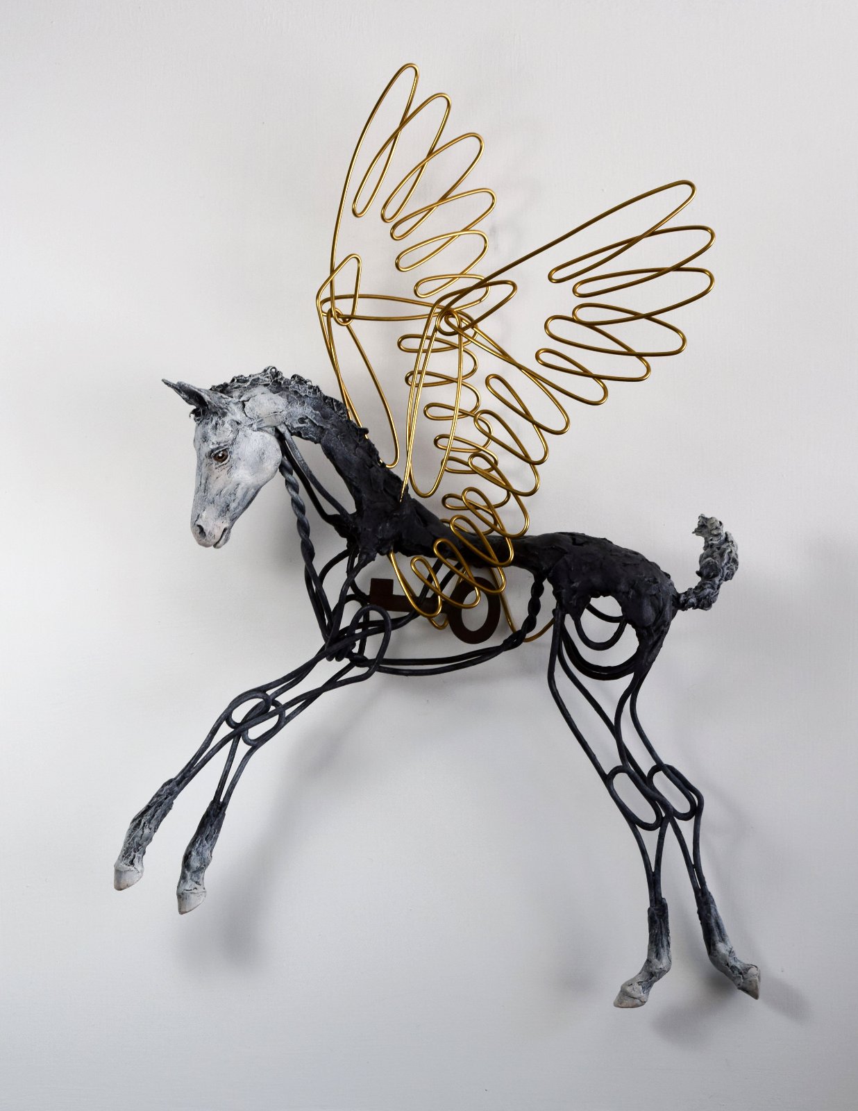 Air dry clay and wire pegasus foal wall sculpture