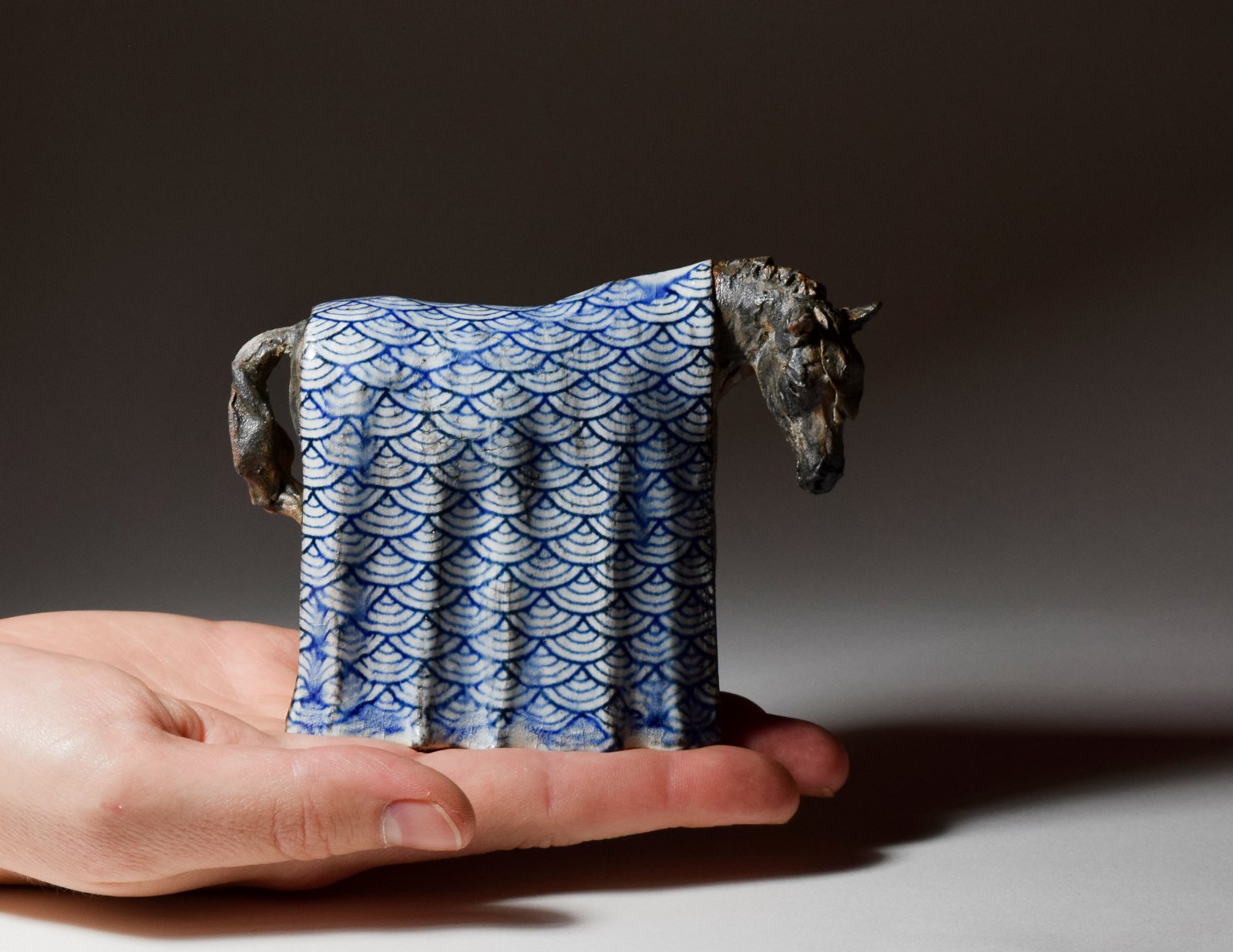 Small ceramic horse sculpture with Japanese pattern blanket